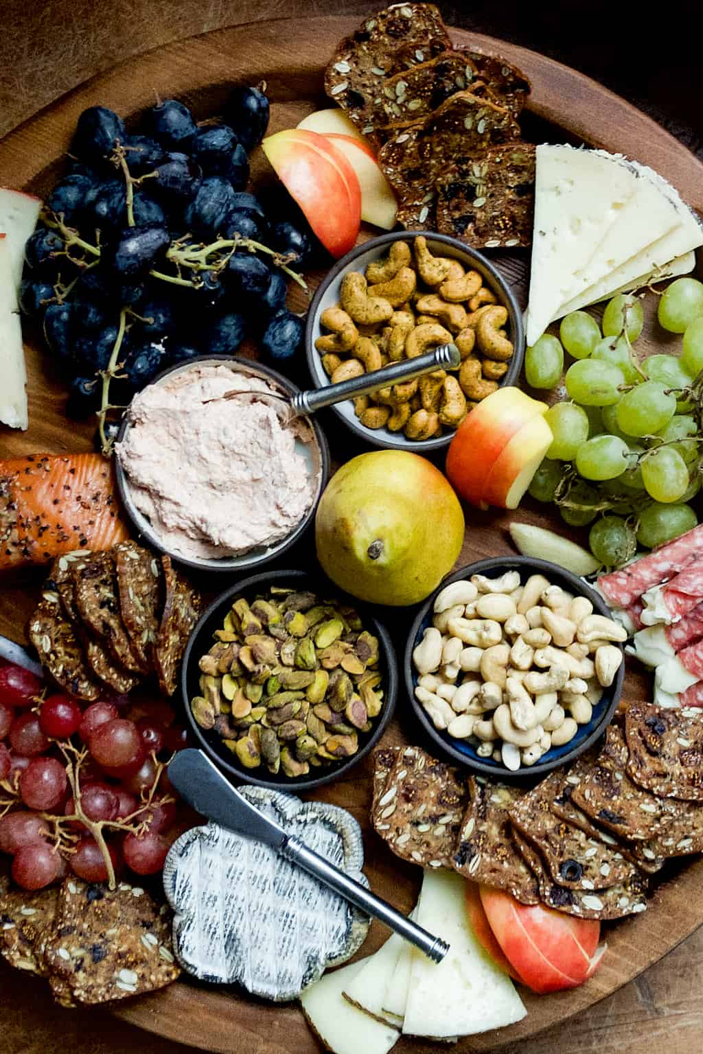 Blue cheese served on a cheese board with assorted fruits